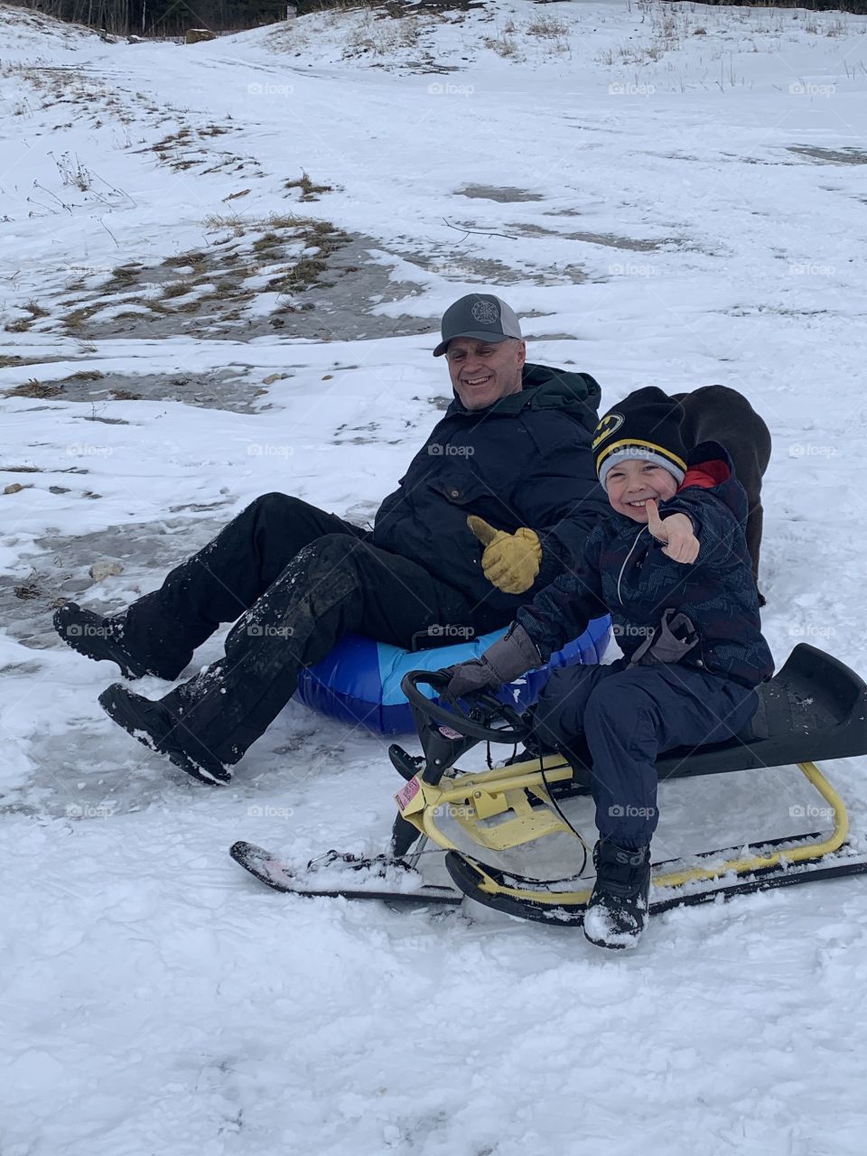 Father and son sledding 