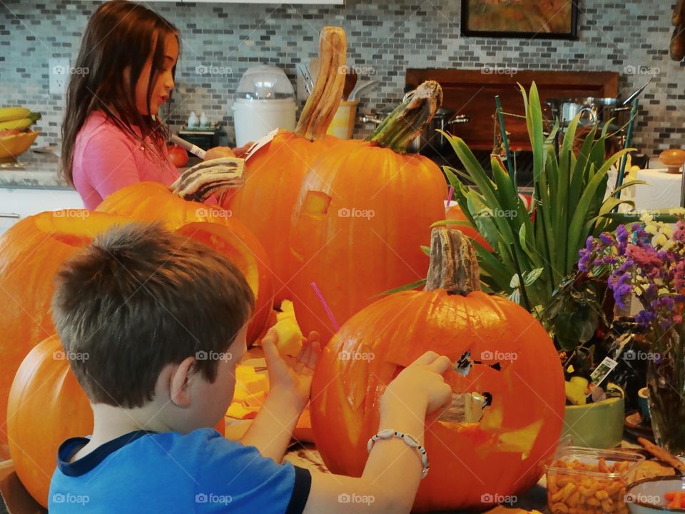 Kids Carving Pumpkins