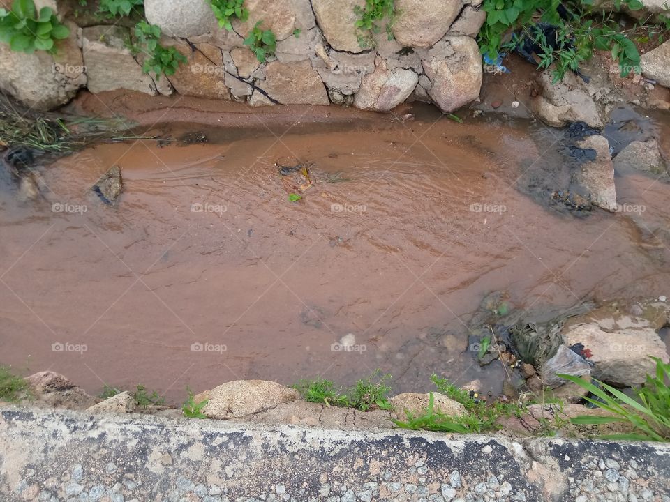 water flowing in the drainage of mission ward of Zing local government of Taraba state Nigeria. this water flowing meet with the one coming from Zendi area and it mixed and flow down to Dankoko.