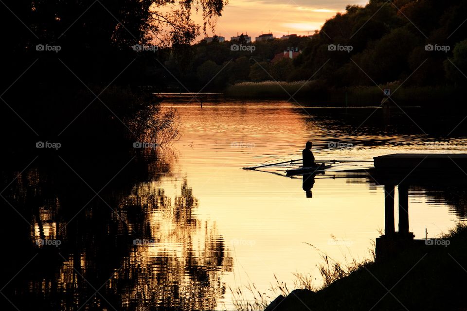 Canoeist in the sunset . Canoeist in the sunset 