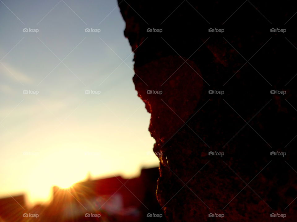 sunlight behind the wall. golden hour - front of my house