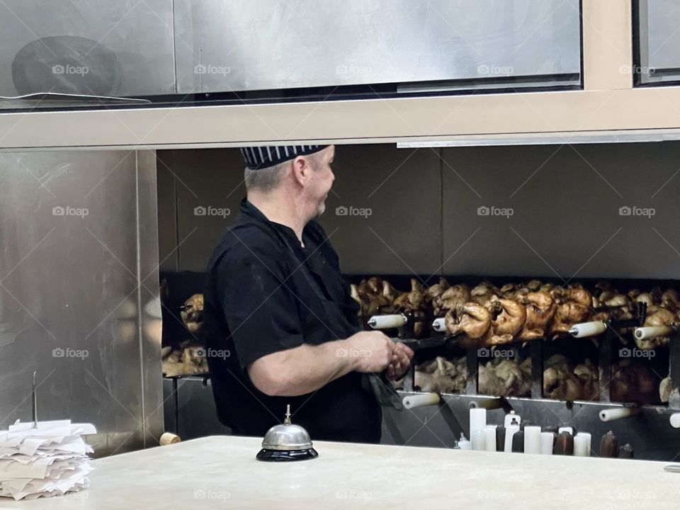 Man doing grilling chicken 