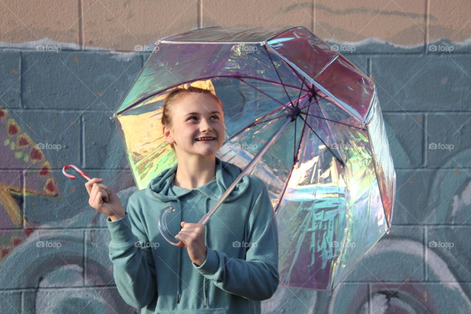 Girl holding Iridescent umbrella