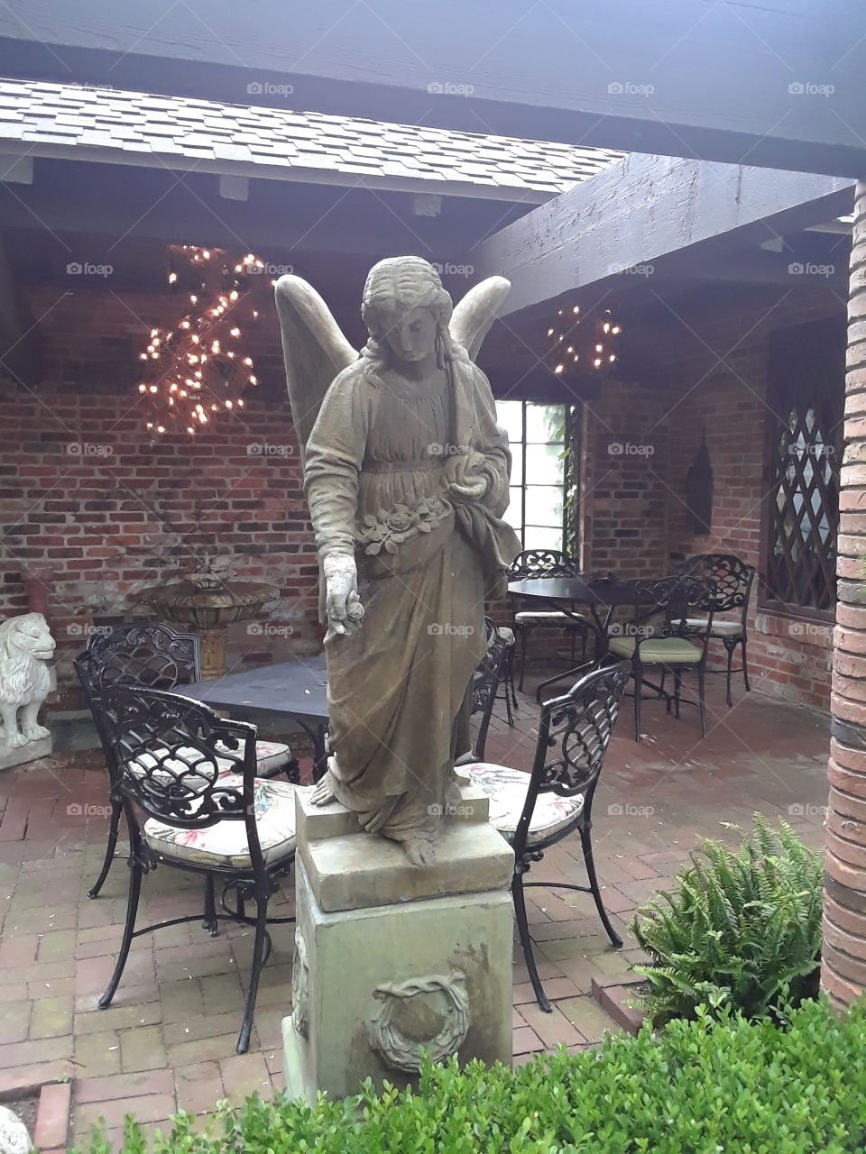 Vivilore restraurant Independence Missouri garden patio dining room Angel statue
