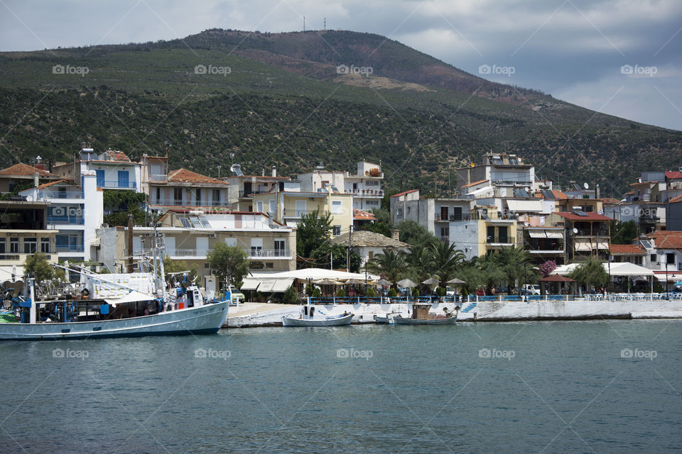 Skala Marion pier. Skala Marion pier and village architecture