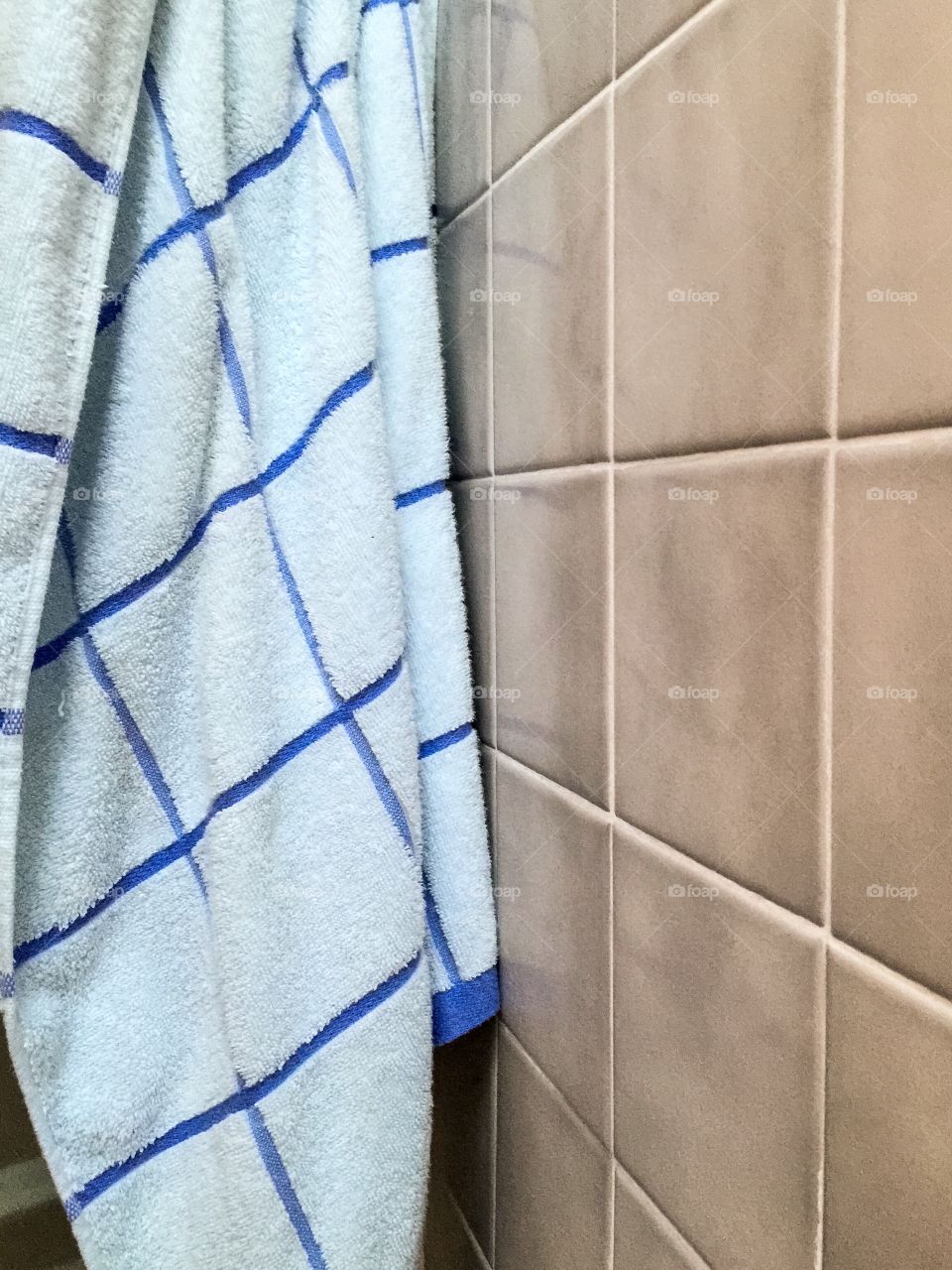 Shower towel and tiles 