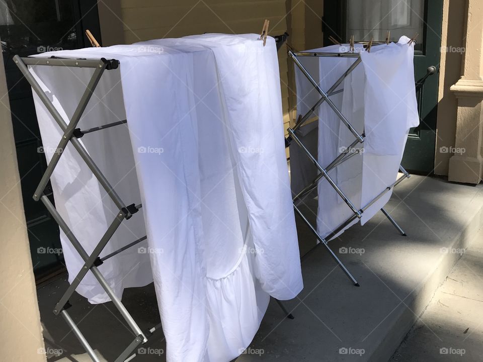 White sheets air drying in the cool spring air