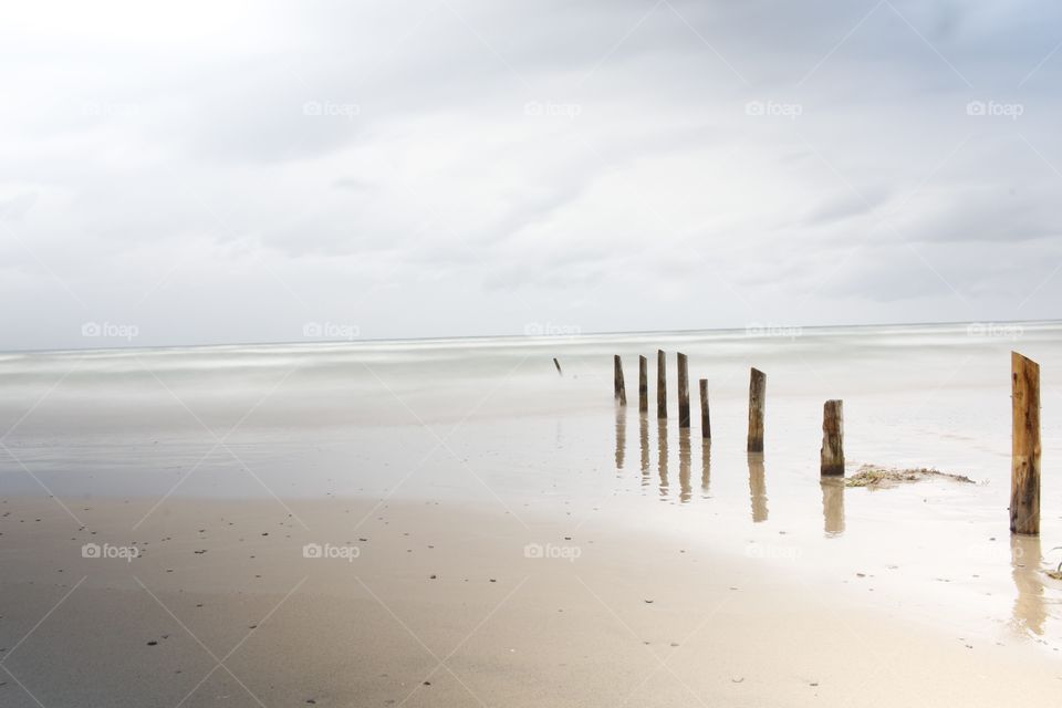 Wooden post at beach