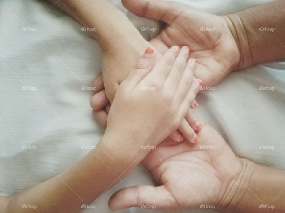 Close-up of two holding hands