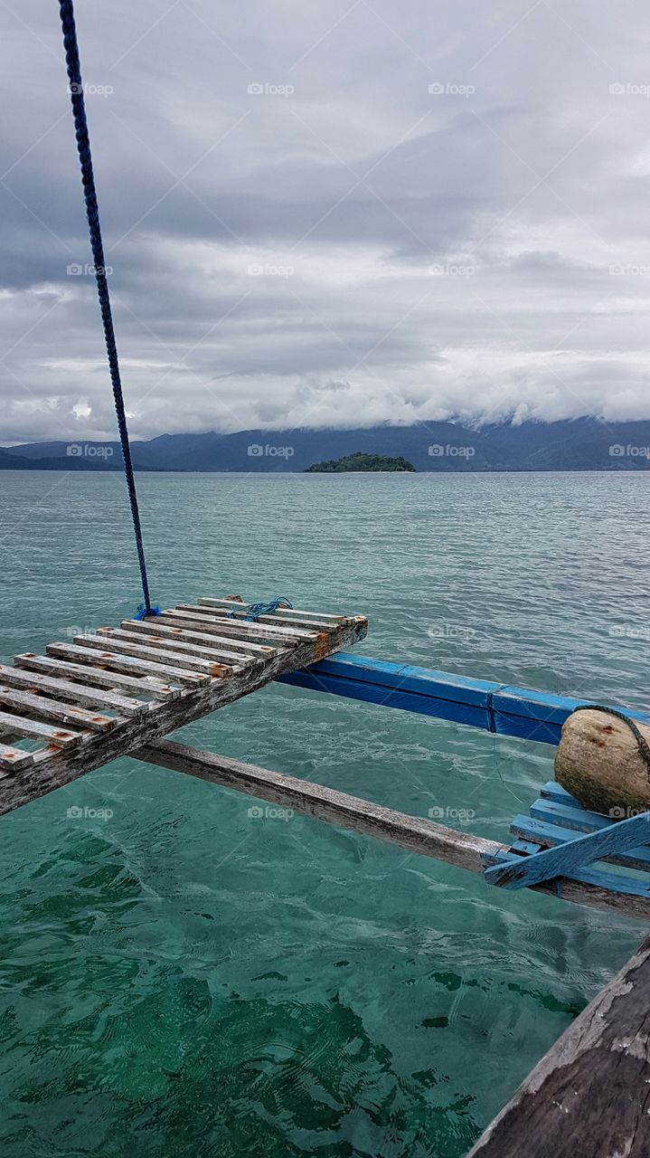 boat ride going to an island in Mati City, Philippines