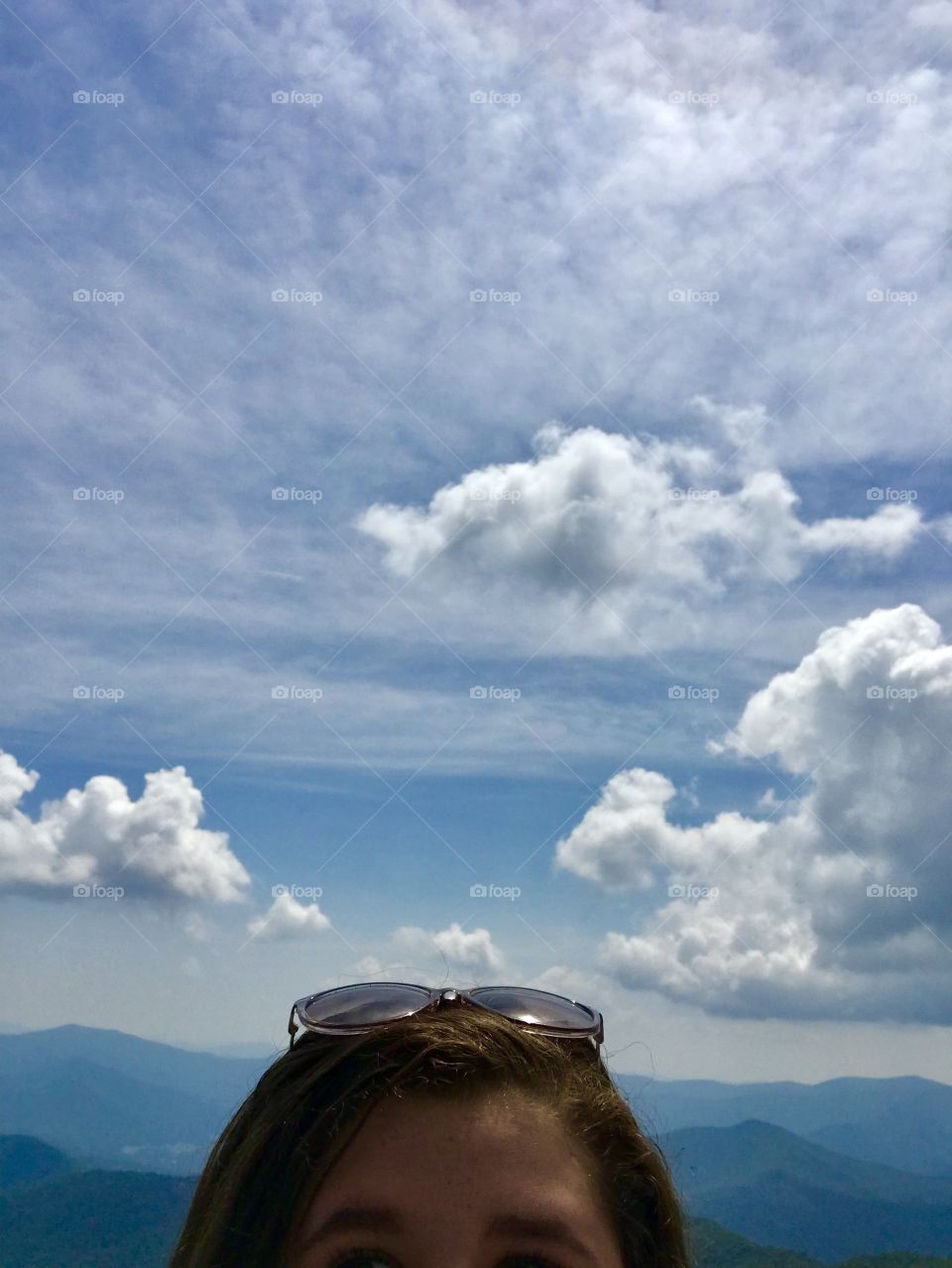 Blue skies, puffy white clouds and smoky mountain tops at 4784 feet in Georgia, USA