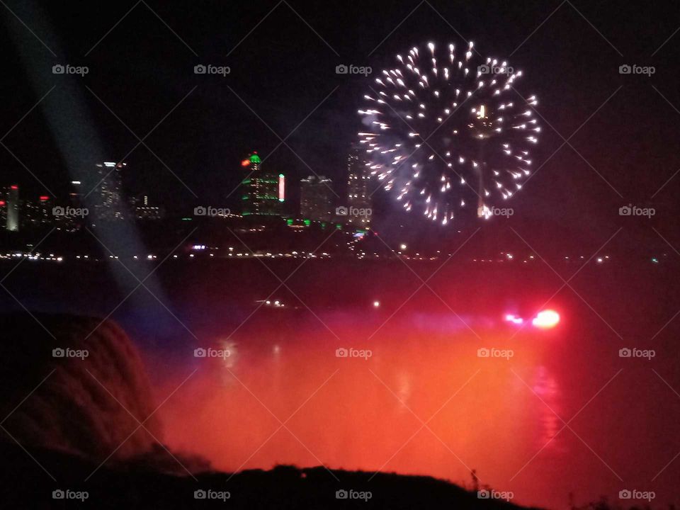 Night fireworks above the falls