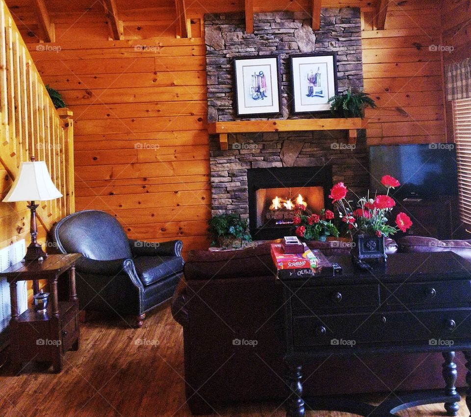 Cozy up in the warm living room of a mountain cabin for family night.