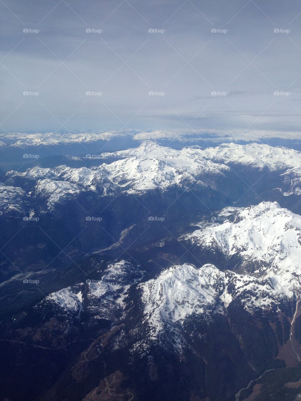 The tops of the snowy mountains of BC