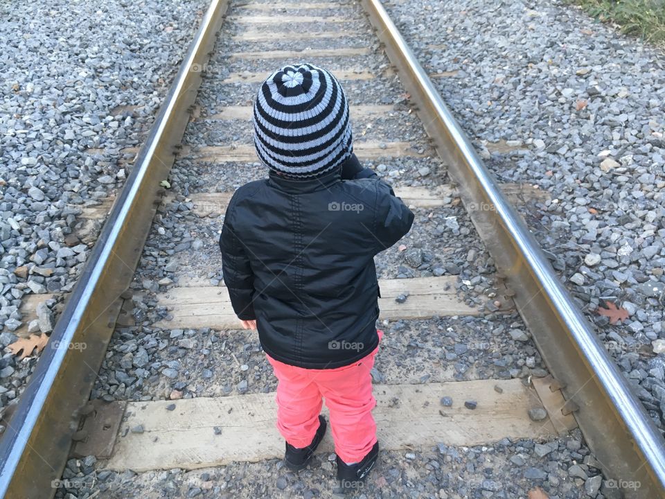Kid and train tracks 