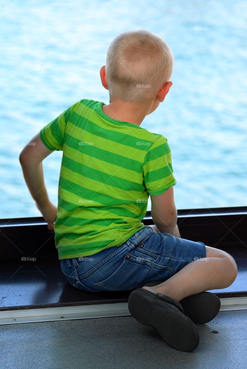 Boy looking out the window