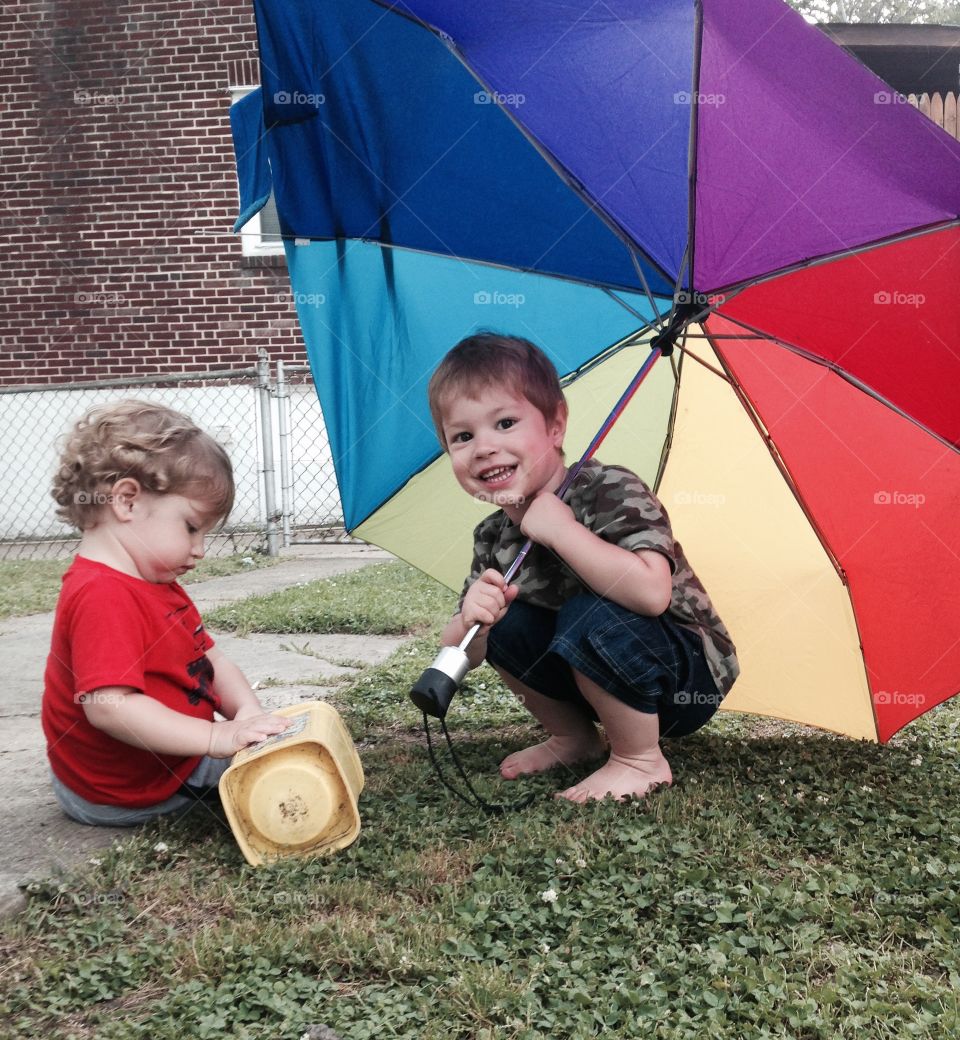 Colorful umbrella . Playing outside with an umbrella 