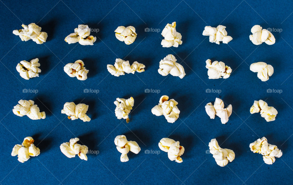 Popcorns in dark blue background 