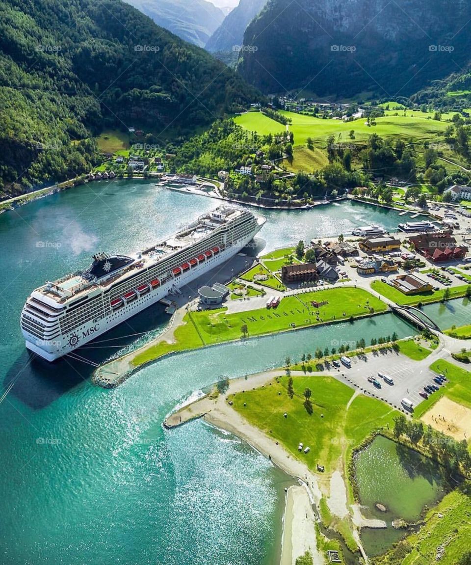 Cruise ship in the seashore and green vegetation