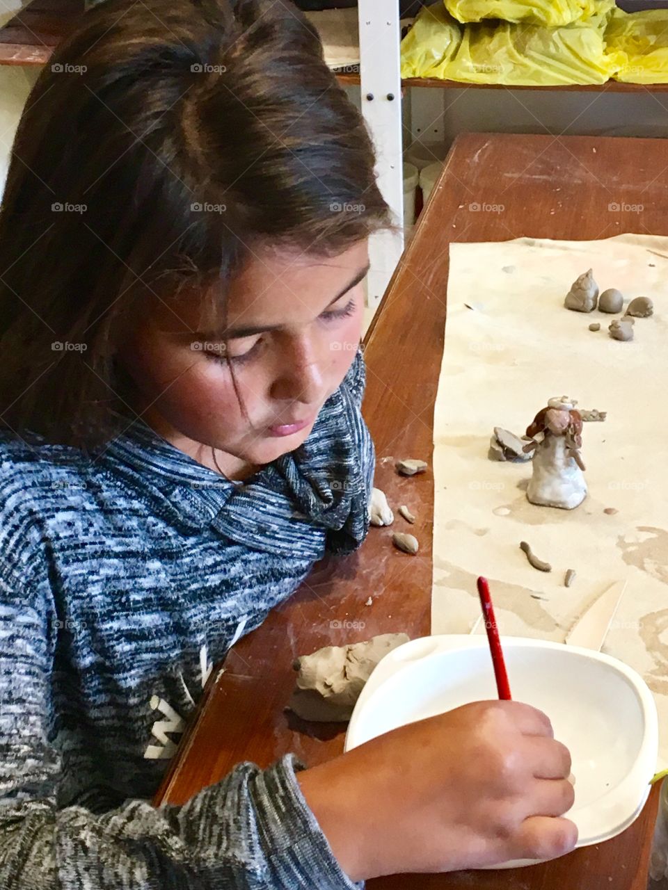 Girl playing with clay