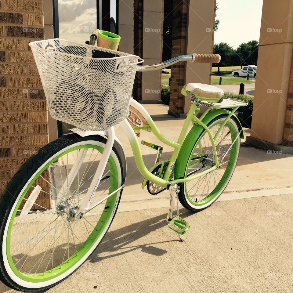 Green bicycle . A student's bicycle on campus 