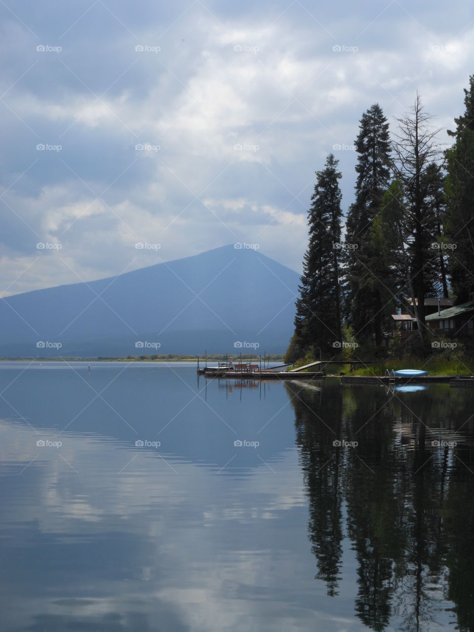 Mountain and trees reflecting in lake