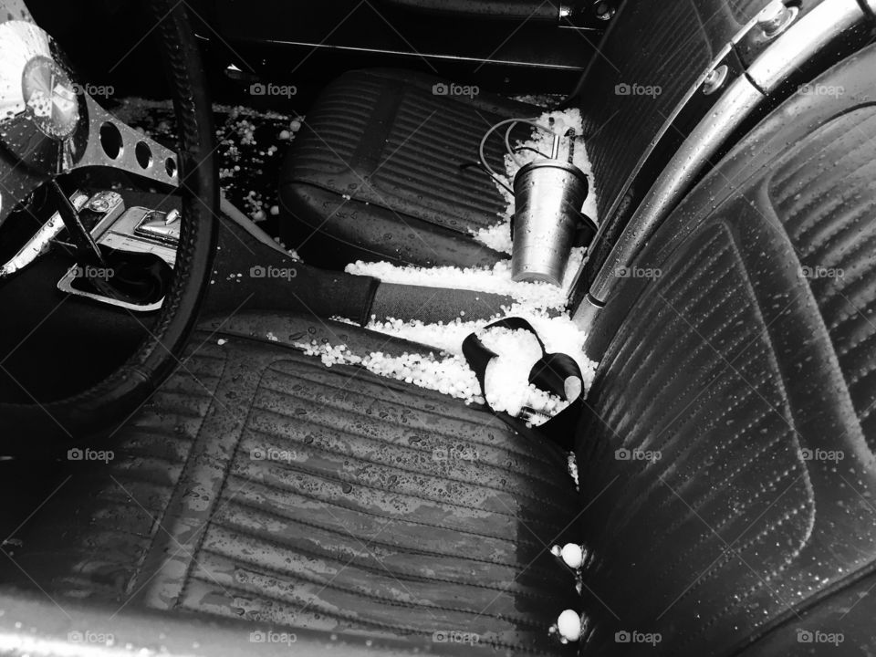 Hail no ! Interior of a 1958 Corvette after a hail storm in Deadwood South Dakota 