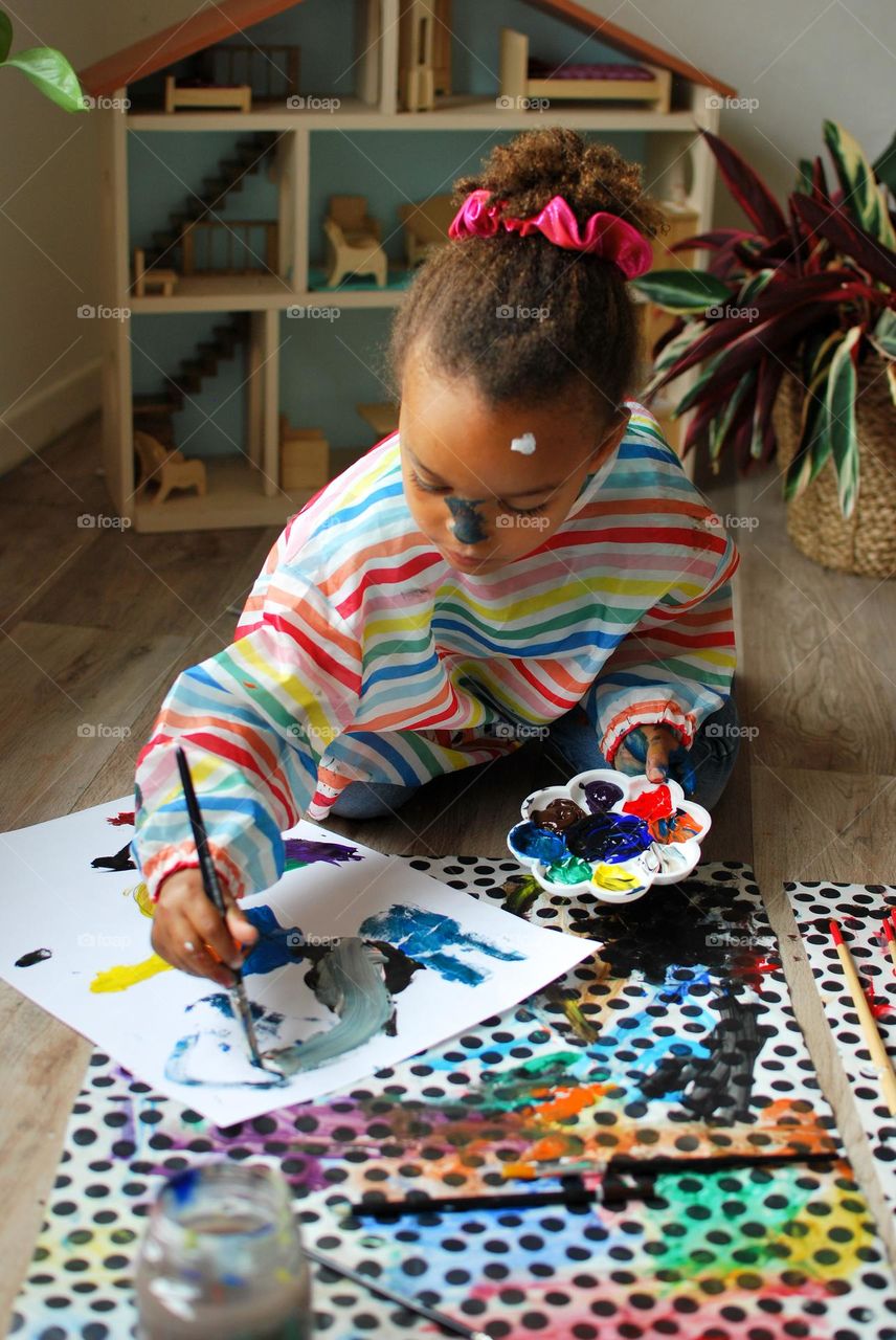 Little girl of mixed race painting