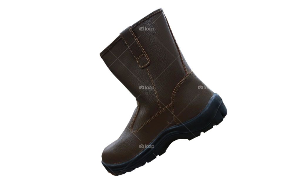 Photo of brown boots on a white background