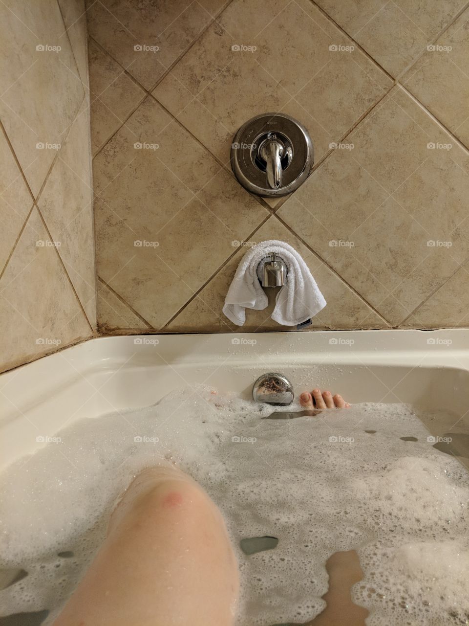 legs in the bathtub