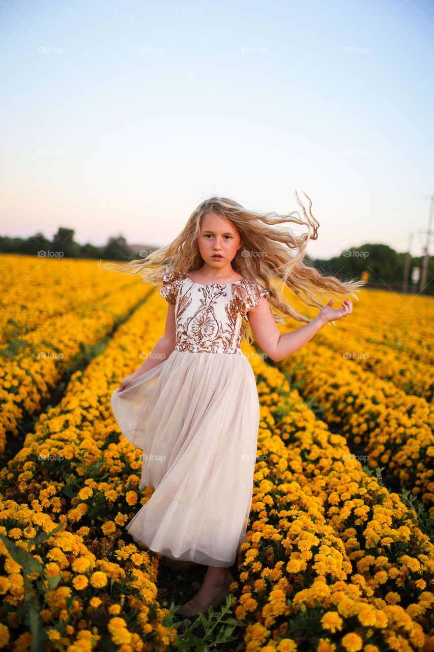 Girl in a yellow flower field