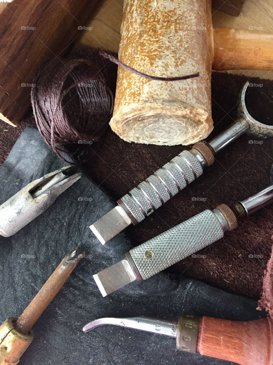 Arts & Crafts Supply - mallet, thread for leather stitching, and leather scraps, leather crafting tools