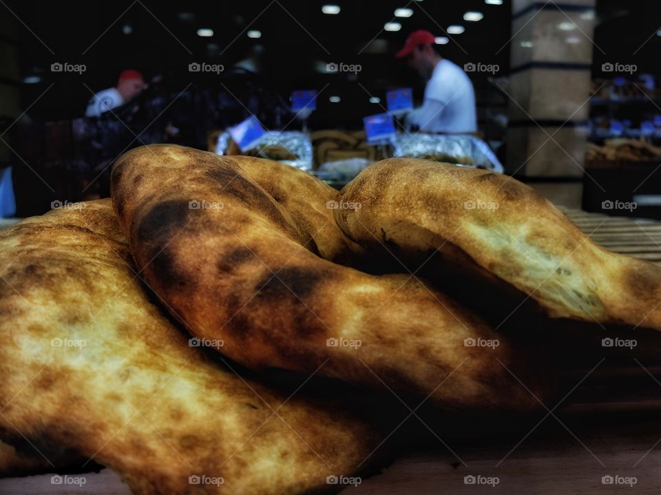 This is Georgian ripe of bread. I've travelled to Armenia where stopped by at one place where they make this bread. It smells so good in there. 