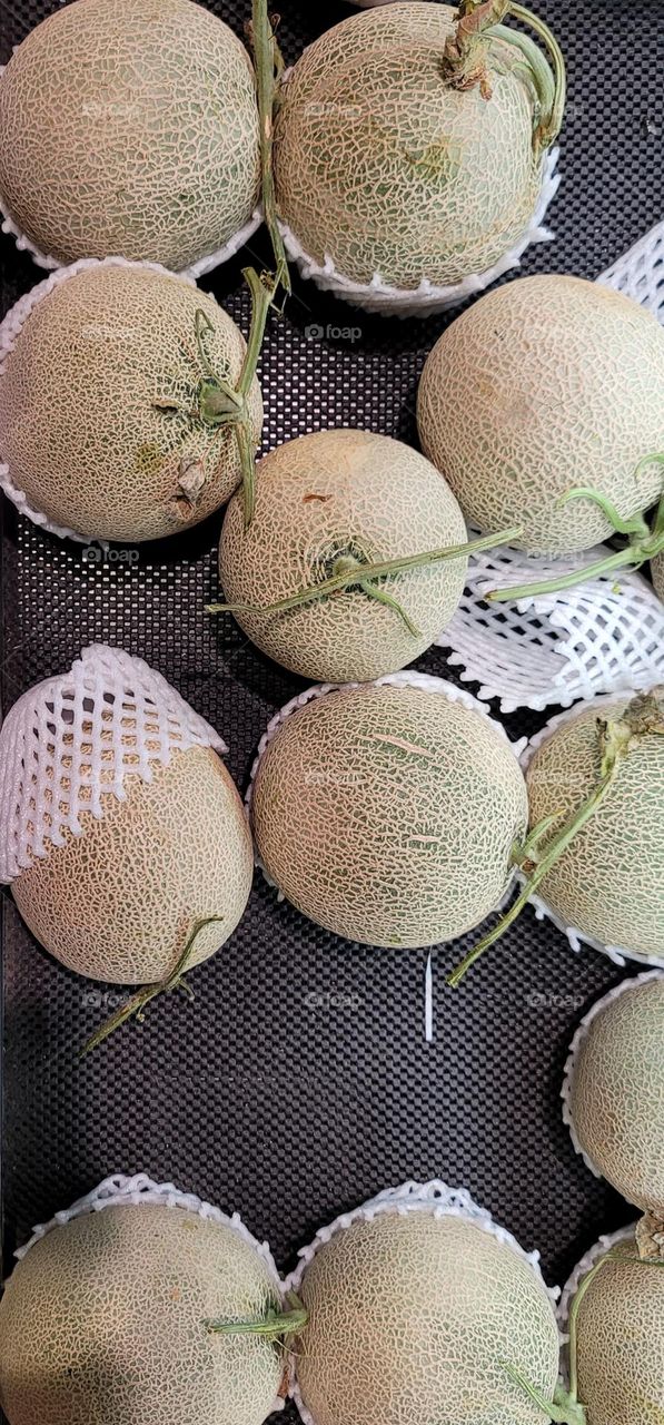 Cantaloupes in supermarket .