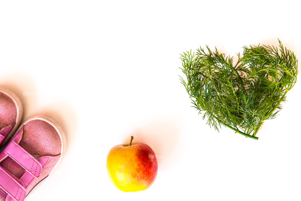 Exercise and healthy food is a way to stay in shape and keep your body healthy. Simple minimalist image on white background
