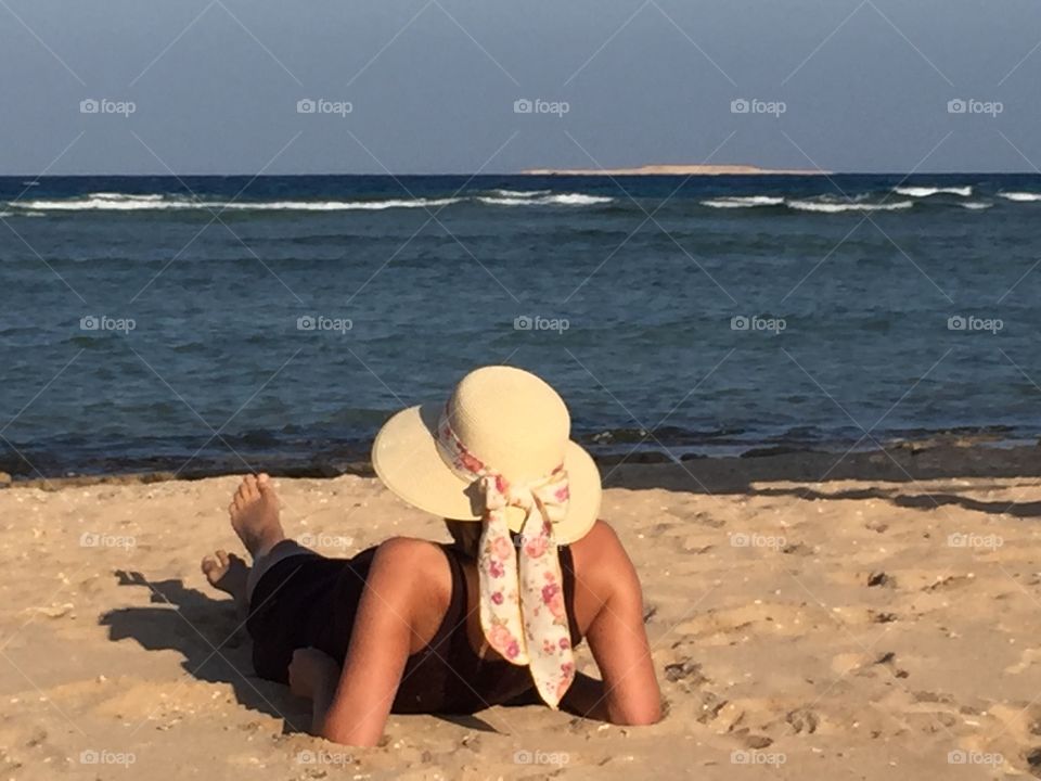 Lying on the Beach - listening to the sound of the waves, smelling the salty air... That's it.