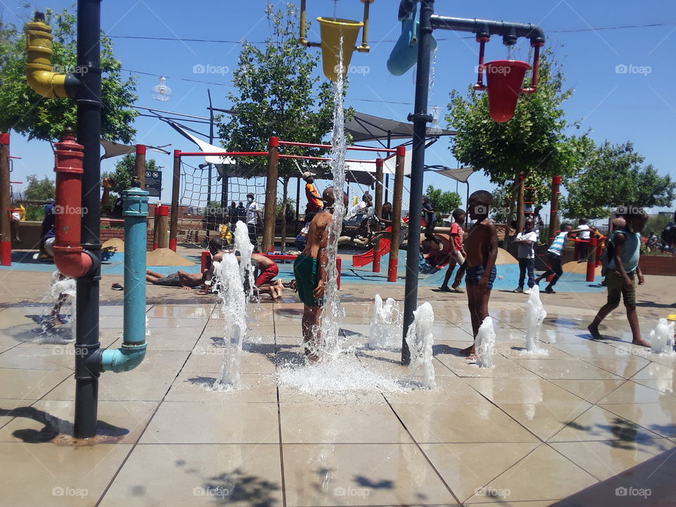 Young people showering outside the complex.