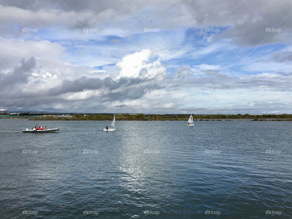 Sailboats under the clouds