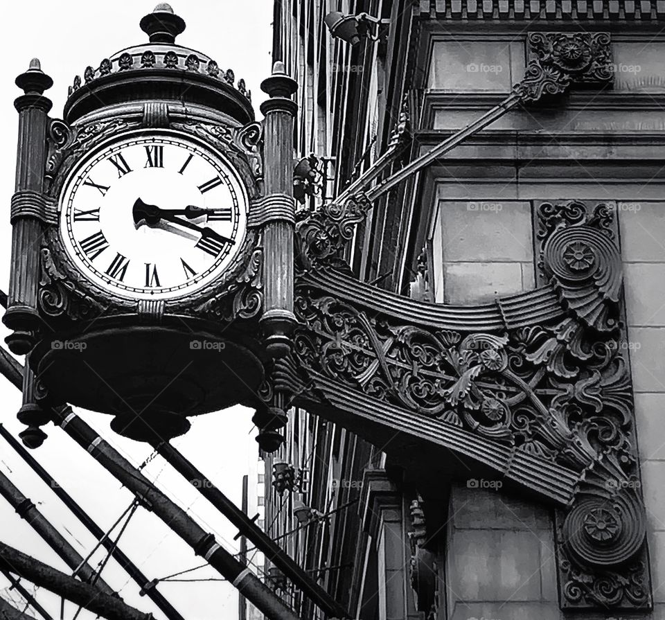 Black and white photo of the Marshall Fields Clock—taken in Chicago, Illinois 