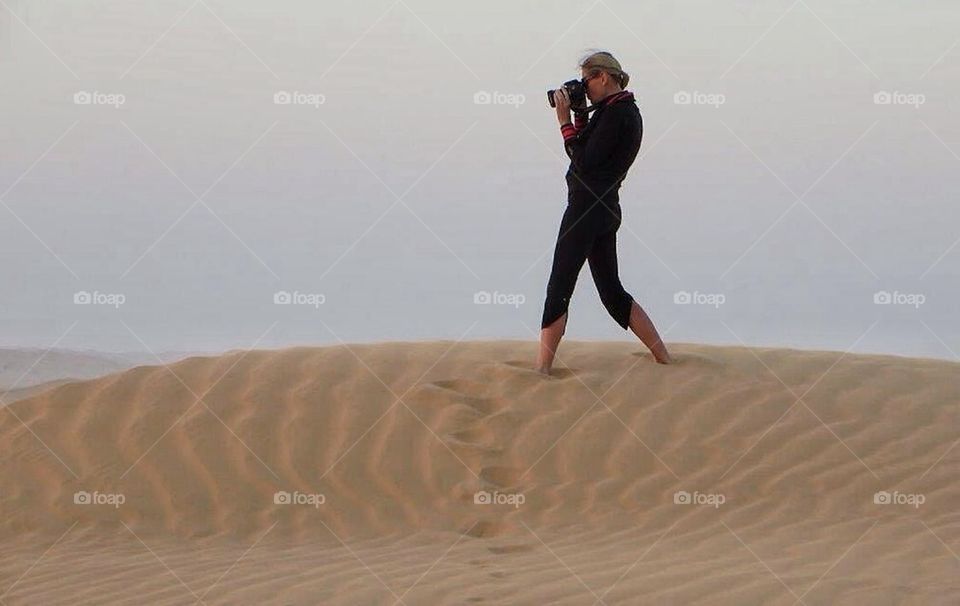 Hiking the sand dunes in Oman
