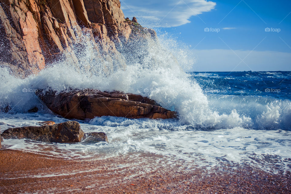 Waves breaking against the rocks