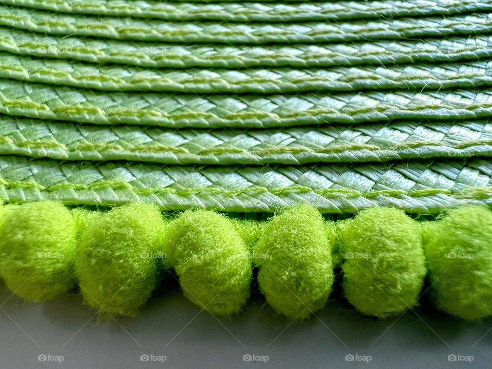 Close up of green abstract item with blobs and shadow light lines layers