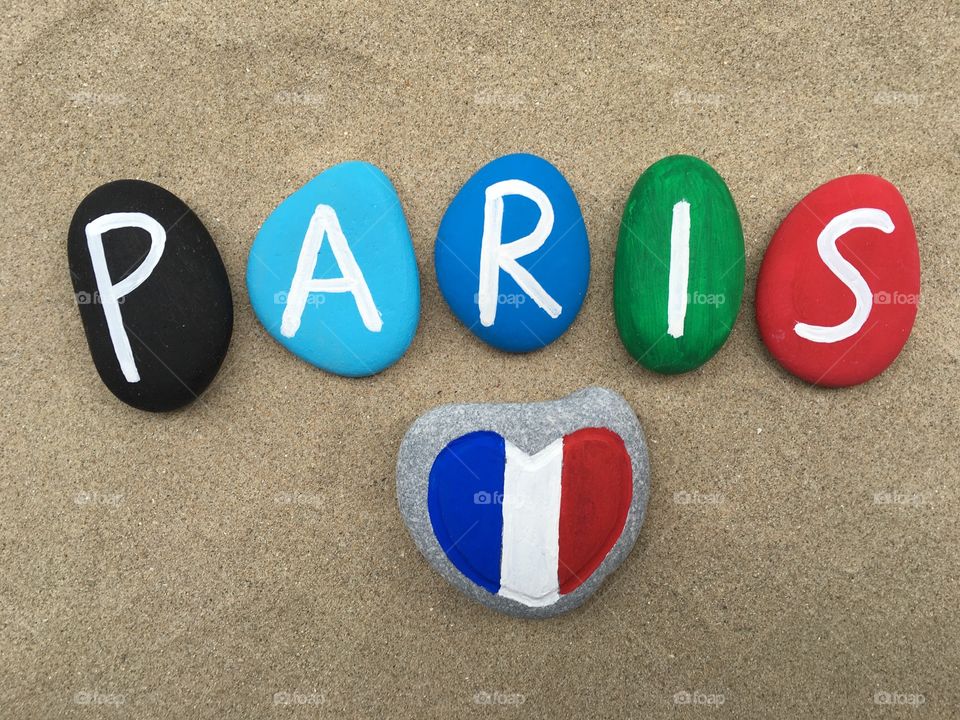 Paris with french flag on a stone heart