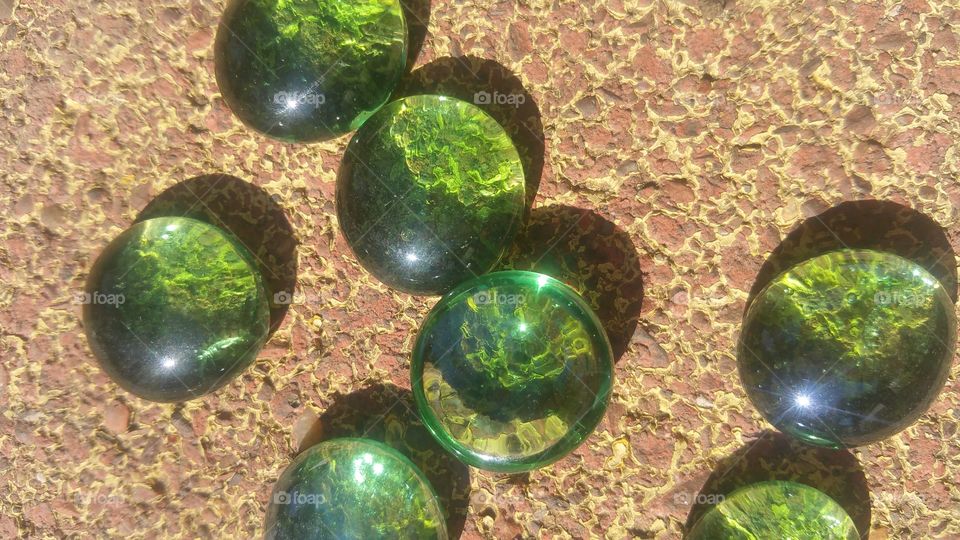 marbles on sidewalk