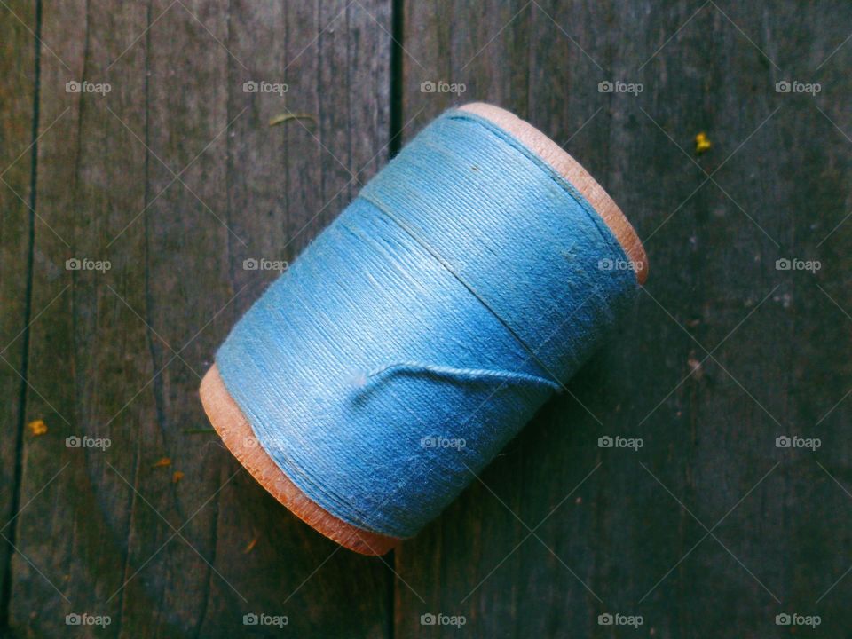 A spool of blue thread
