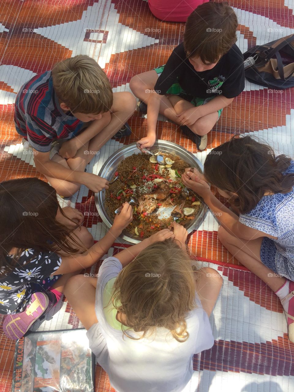 Children sharing a plate of food
