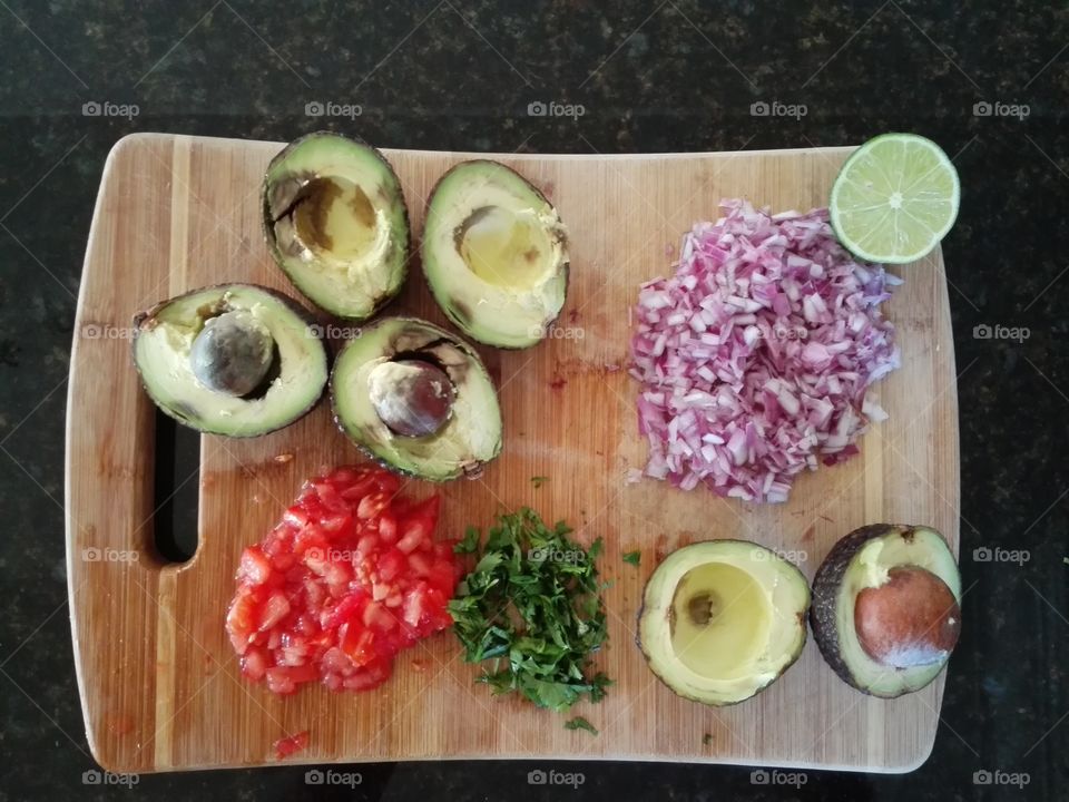 Guacamole ingredients on cuttingboard