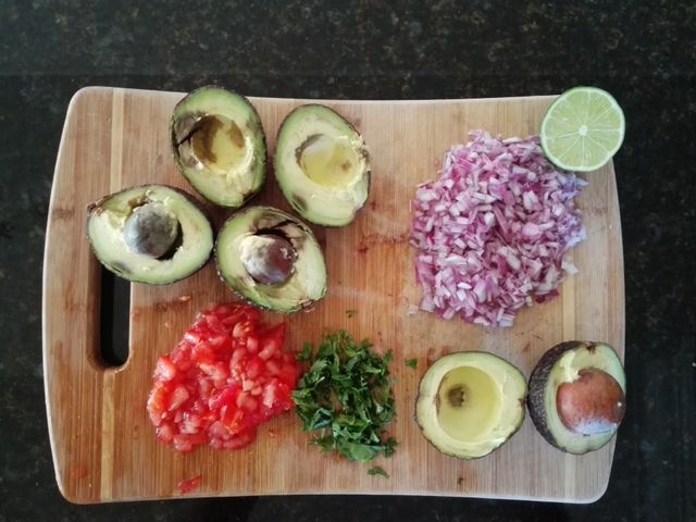 Guacamole ingredients on cuttingboard