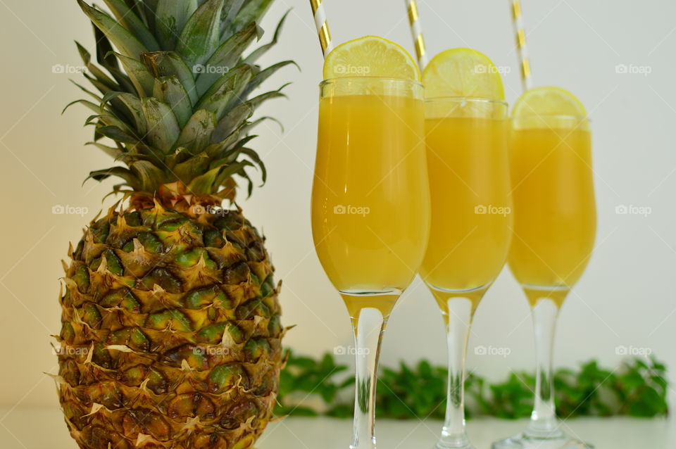 Three glasses of pineapple juice, please