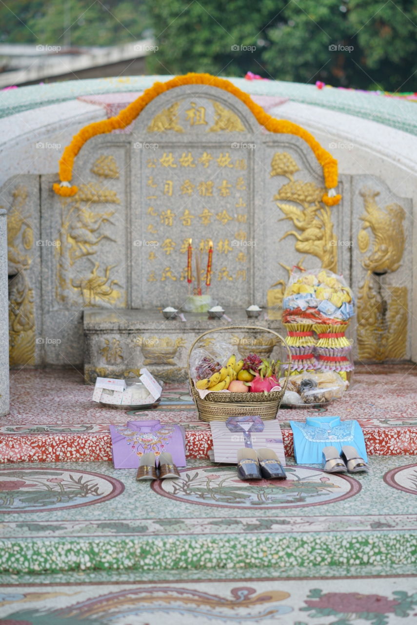 Tomb sweeping day. Or Qing Ming festival, in Chinese, where family would go to clean their ancestor's tomb, decorate the tomb with colorful rainbow papers & food offering. Chinese text is good wishes.